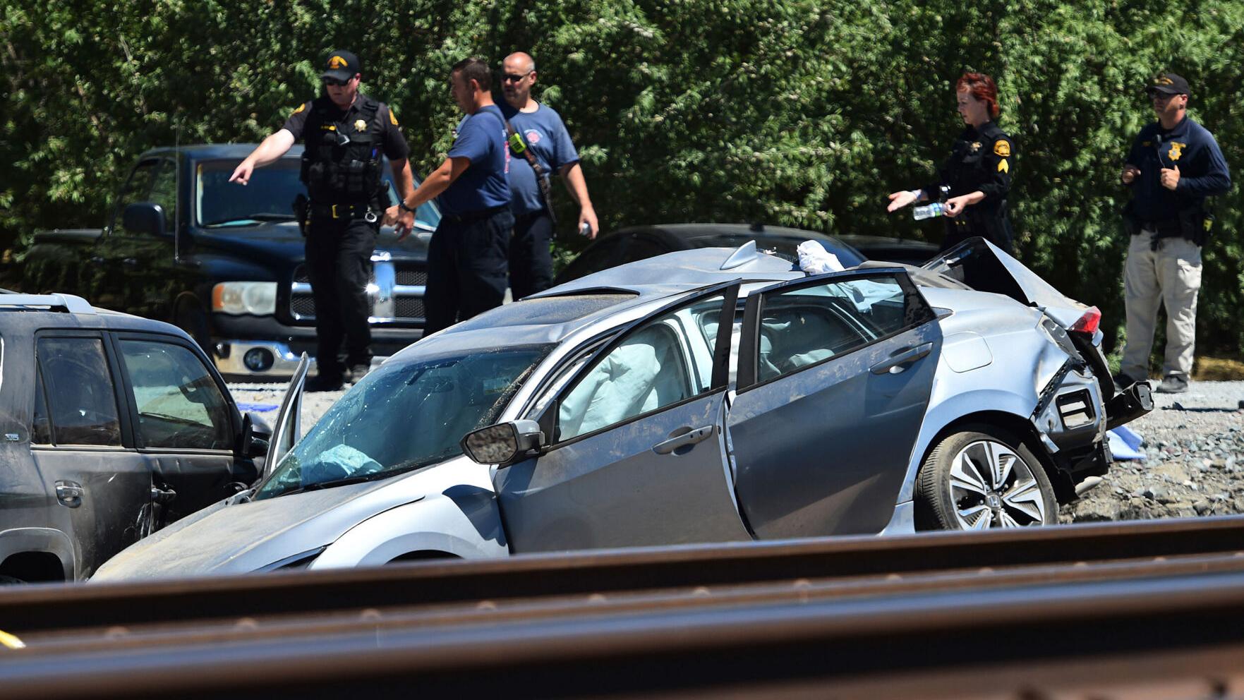 Train collides with vehicle at California intersection without crossing arms, killing three